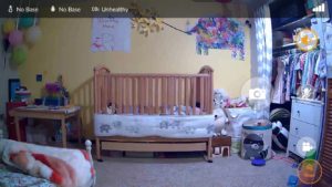 A screenshot from the iBaby Care app displaying a crib in a kid's room