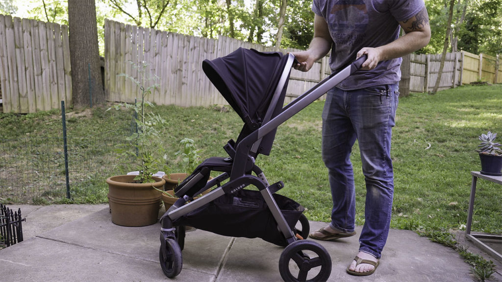 The Colugo Complete stroller in a backyard