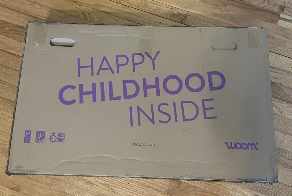Woom 1 box. It says "Happy Childhood Inside" 